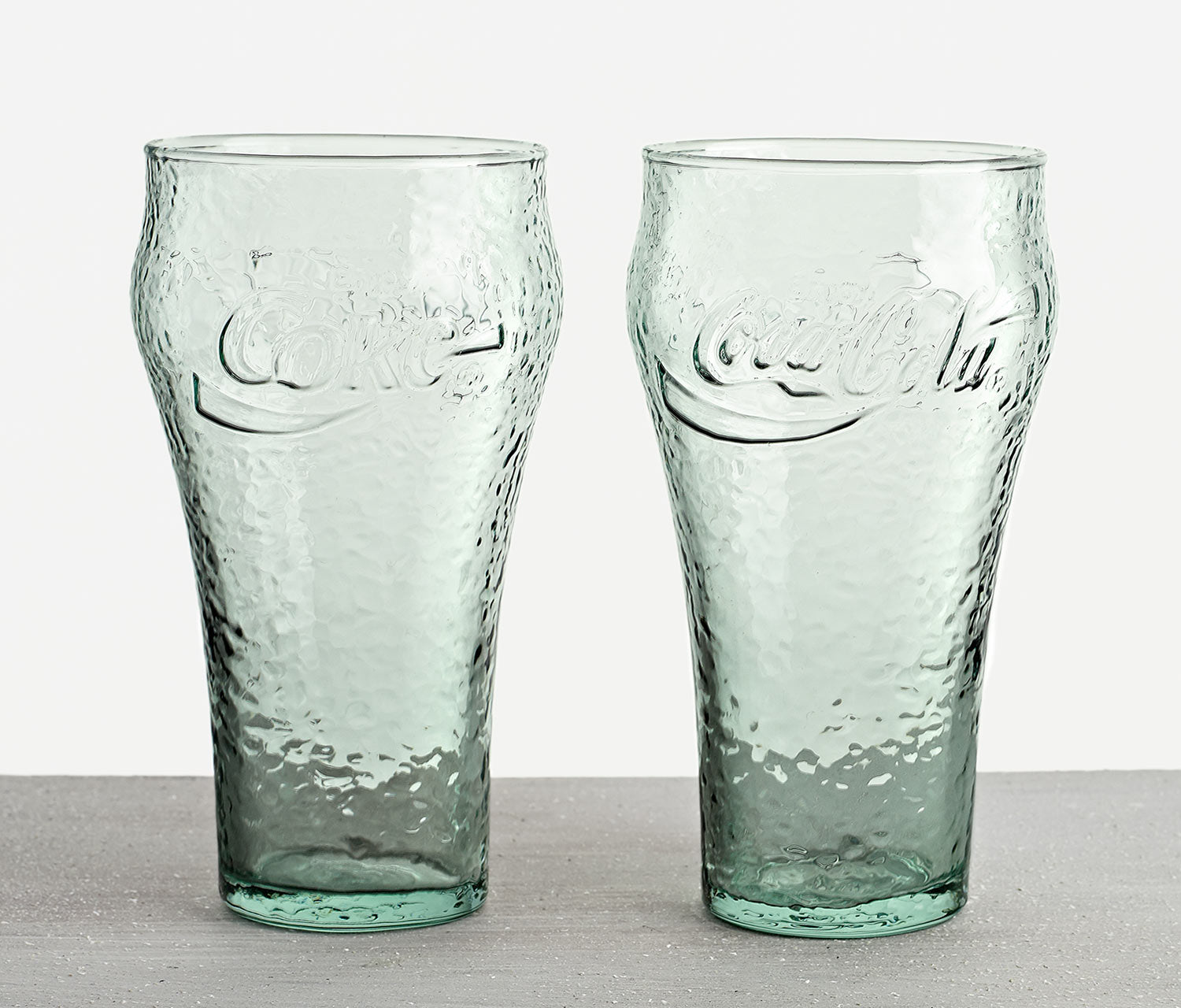 http://lollygag.co/cdn/shop/products/Vintage-Coca-Cola-Coke-Pebbled-Green-Glass.jpg?v=1673832297
