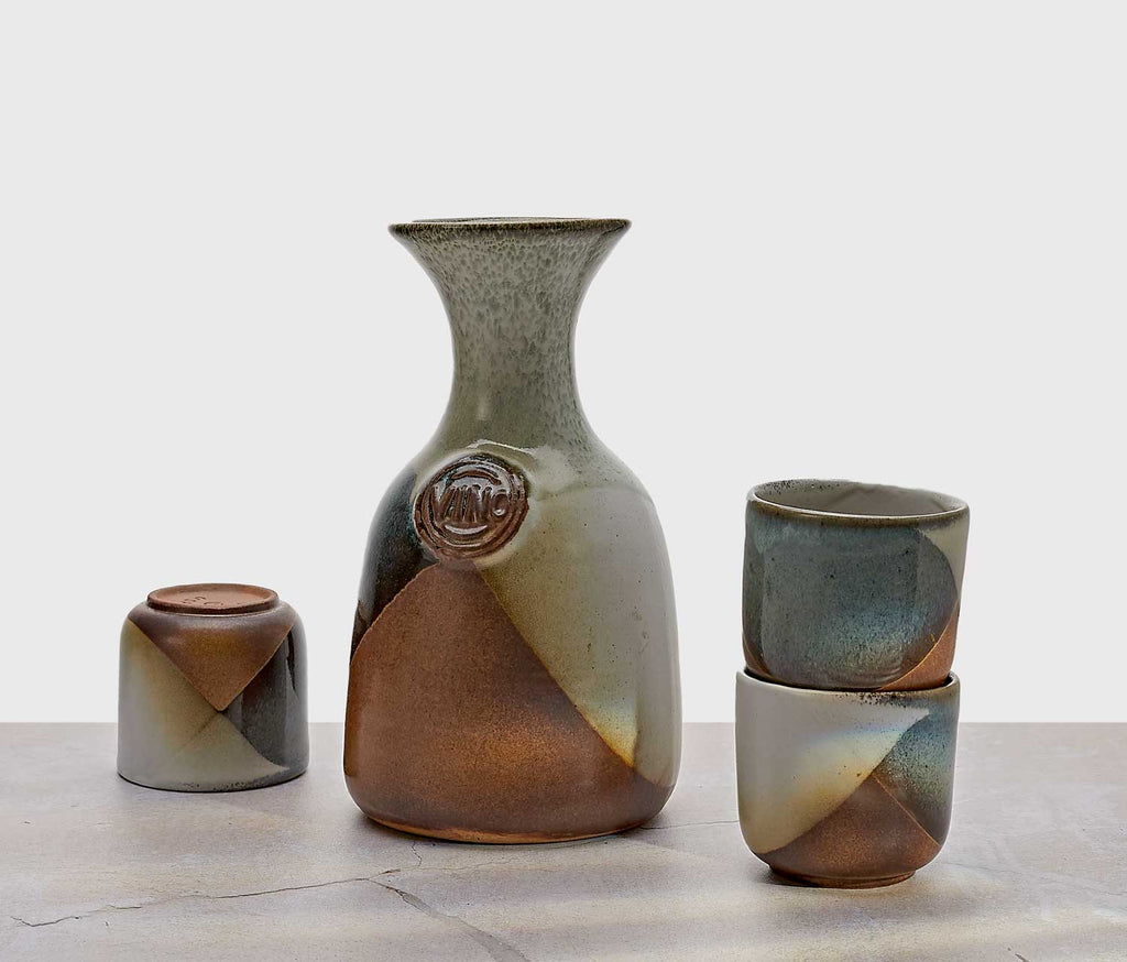 Pottery Craft Set of ceramic vases with earthy tones on a light background