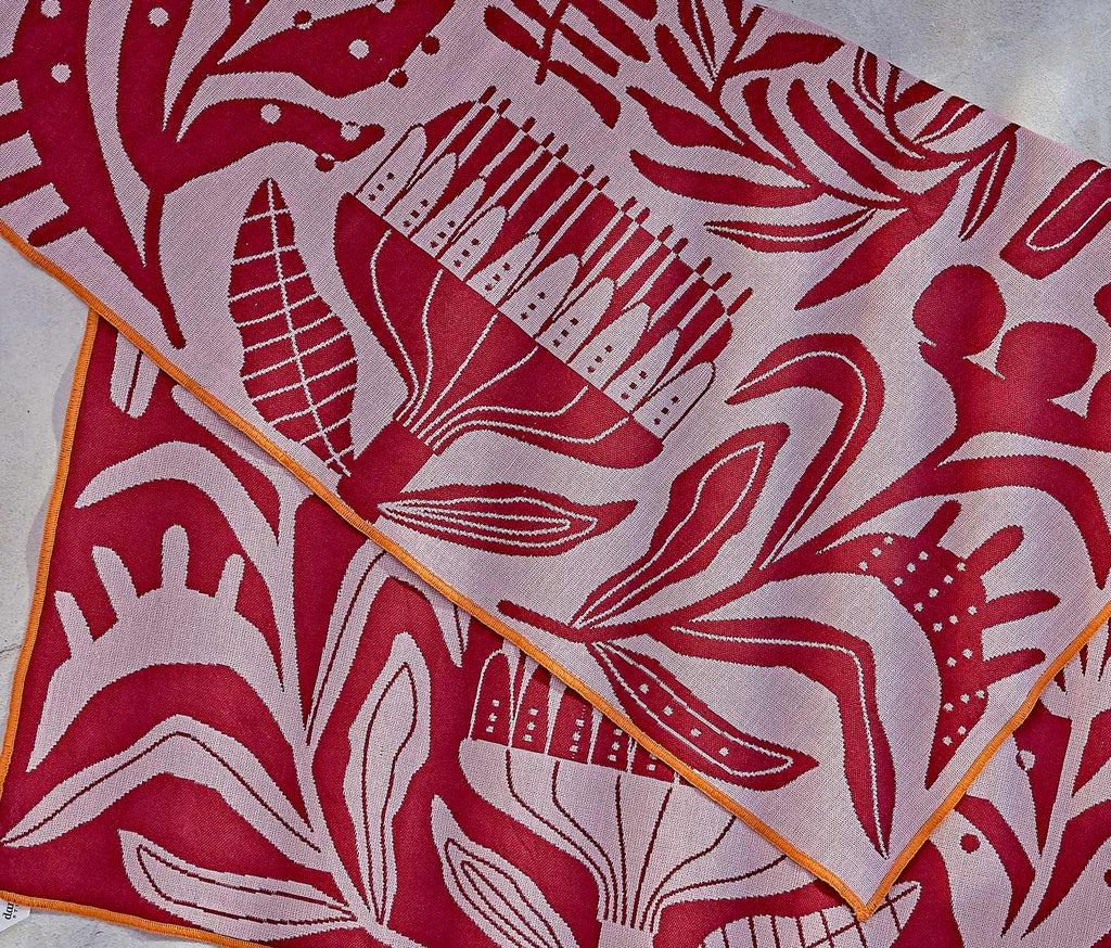 Red and white venus fly trap patterned fabric with abstract designs on a light background - lollygag