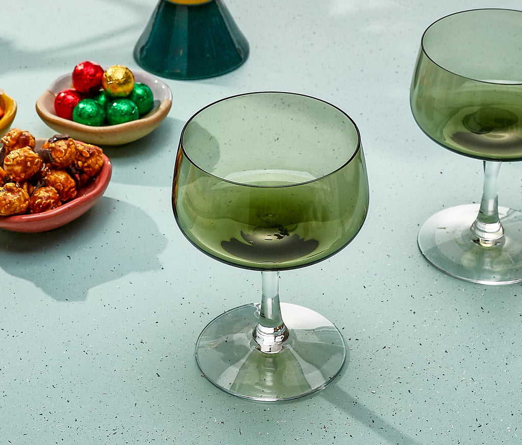 Vintage Fostoria coupe glass with pine-green bowl and clear stem, retro mid-century stemware