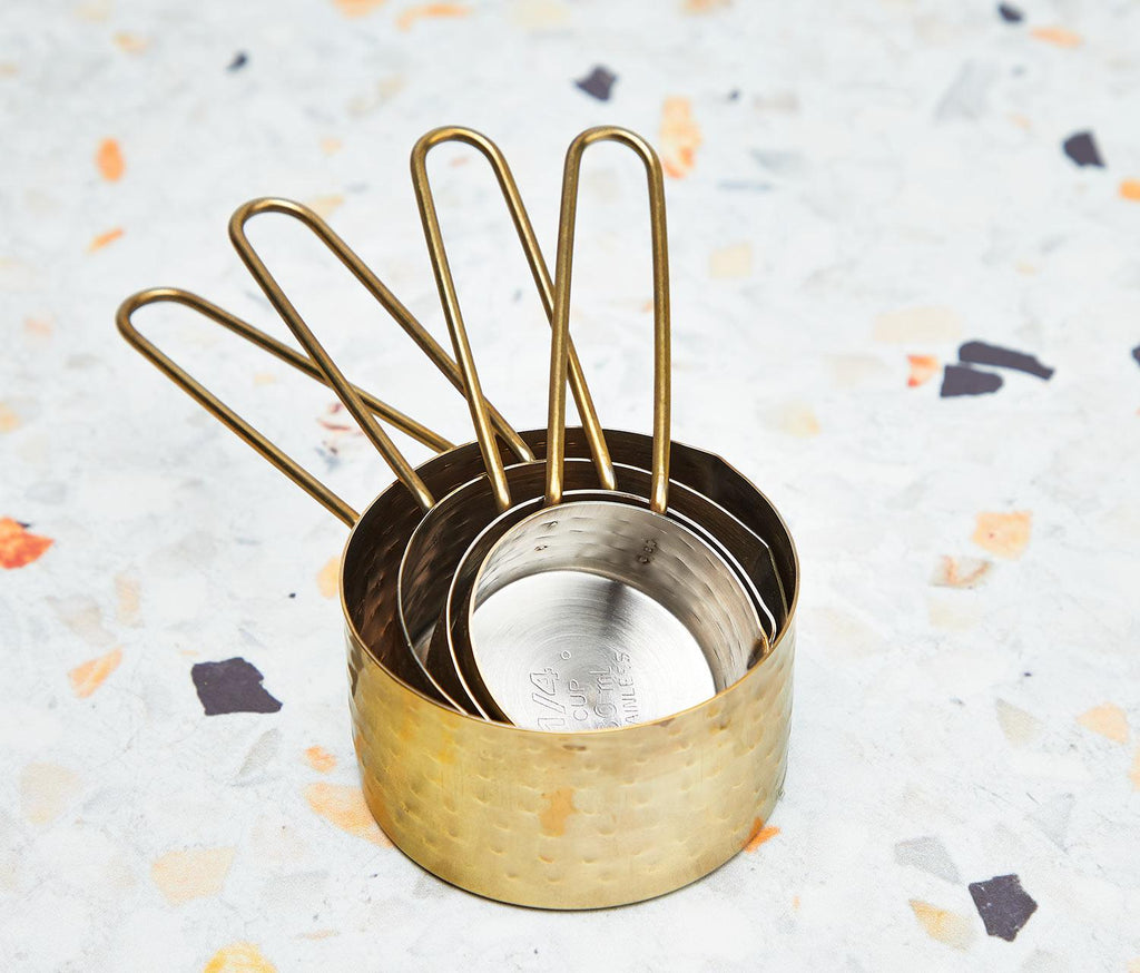hammered gold and silver measuring cups set